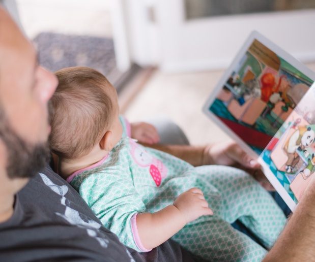 Man and baby reading a book