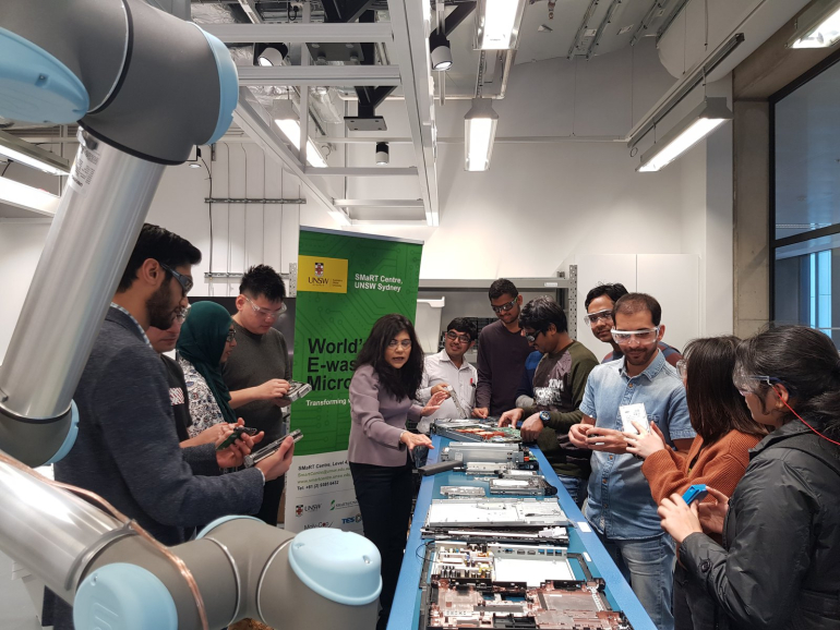 A group of students at the UNSW SMaRT Centre learning about e-waste microrecycling
