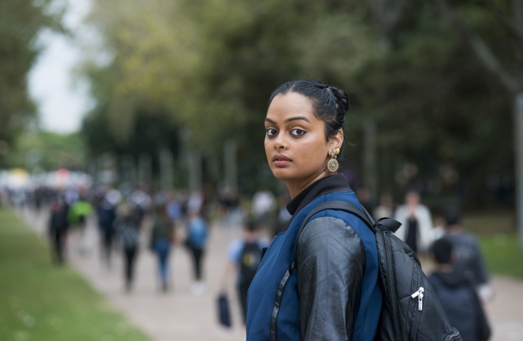 Female UNSW student on the university walkway