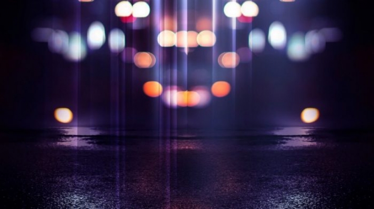 Blurred lights on a dark street at night