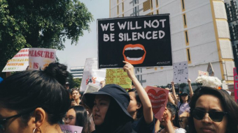 Photo of people rallying in the street at Women's March 2019, Kuala Lumpur by Michelle Ding on Unsplash.