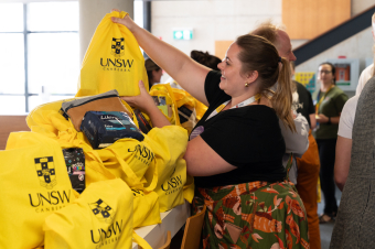 Staff collecting sanitary products donated at the International Women's Day 2024 morning tea at UNSW Canberra