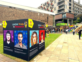 The cube displaying information on UNSW queer researchers at Pride on the Quad (Mardi Gras 2024).