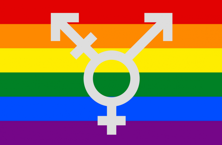 Gender inclusive logo on LGBTIQ+ rainbow background