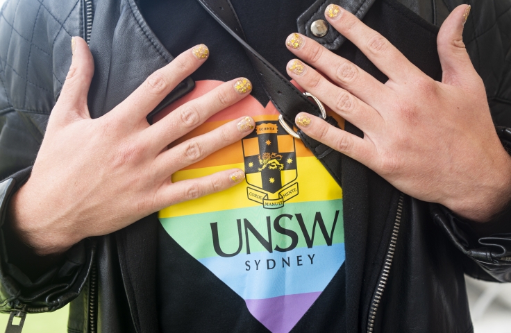 UNSW Pride rainbow heart on a black t'shirt
