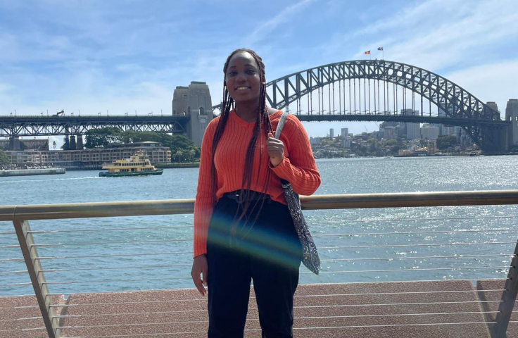 Woman standing in front of the Sydney Harbour Bridge