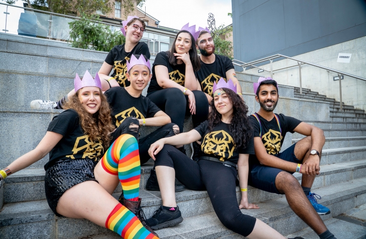 Students posing on steps before the Mardi Gras Parade