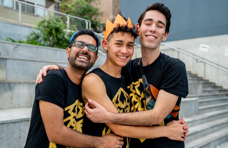Three male UNSW students participating in Mardi Gras