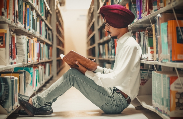 Boy studying in library